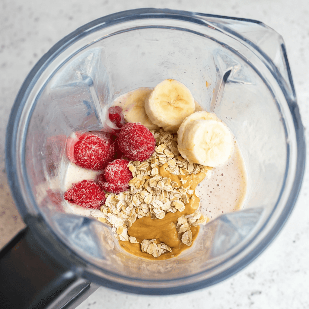 The Only Greek Yogurt Smoothie Recipe You'll Ever Need greek yogurt smoothie Ingredients added to blender for Greek yogurt smoothie