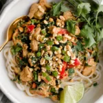 Vibrant Thai peanut chicken noodle bowl, a delicious chicken dish inspiring creative meals; explore *chicken crockpot recipes* for tender options.