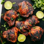 Vibrant grilled chicken meal with fresh herbs and citrus, showcasing delicious Boneless Skinless Chicken Thighs.